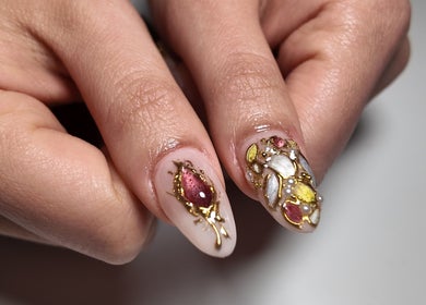 Intricate, gold-embellished nail art at Yorrnails, Melbourne, Victoria, AU. Perfectly manicured elegance.