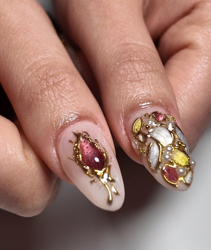 Intricate, gold-embellished nail art at Yorrnails, Melbourne, Victoria, AU. Perfectly manicured elegance.