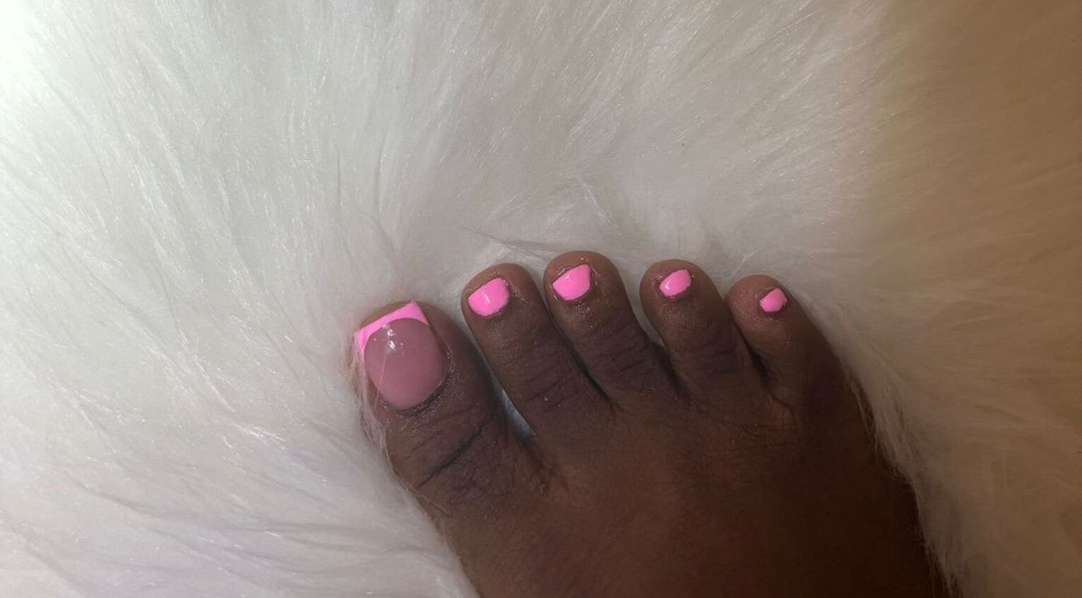 Chic pink toe nails at The Nail Candy, Cave Hill, Saint Lucy, BB on a fluffy white background.