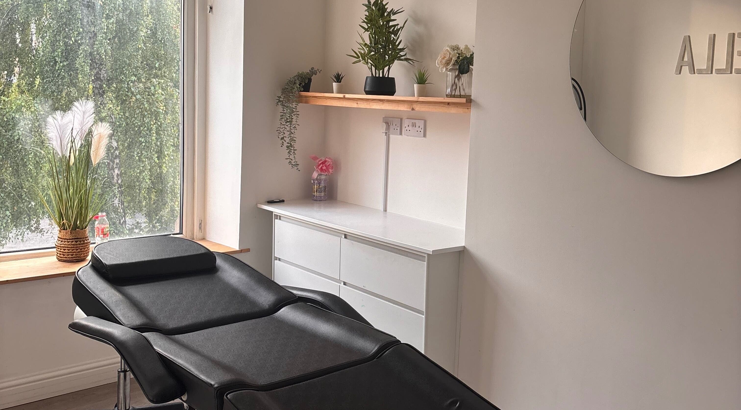 Relaxing beauty therapy room at ByEllebeauty, Darwen, England, GB with minimalist decor and greenery.