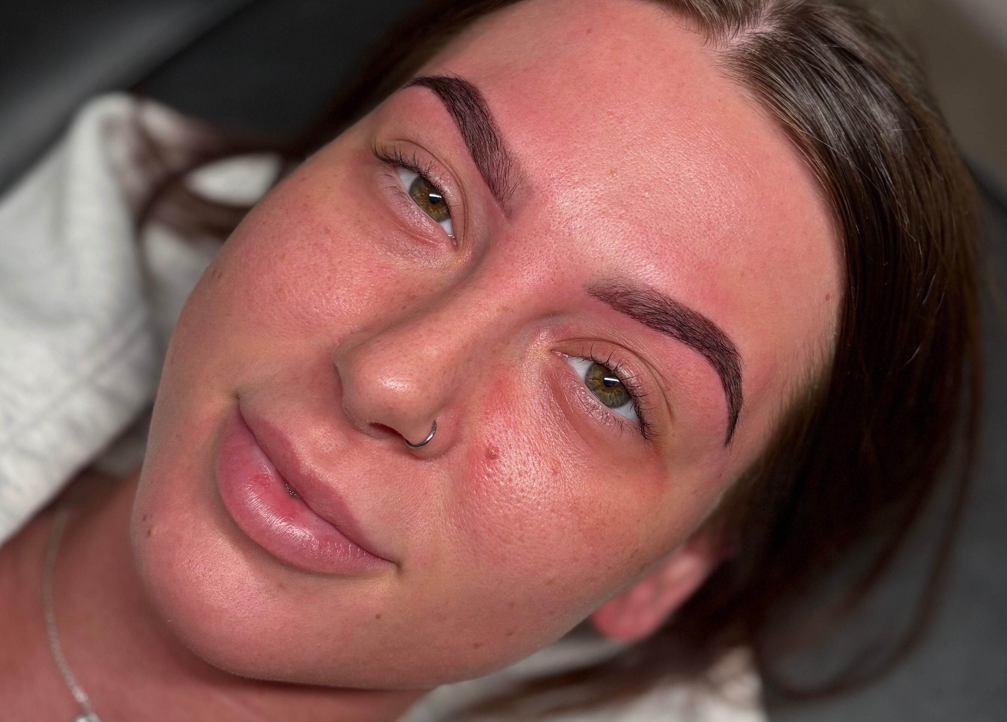 Close-up of a woman's face showing perfect eyebrows at ByEllebeauty, Darwen, England, GB.