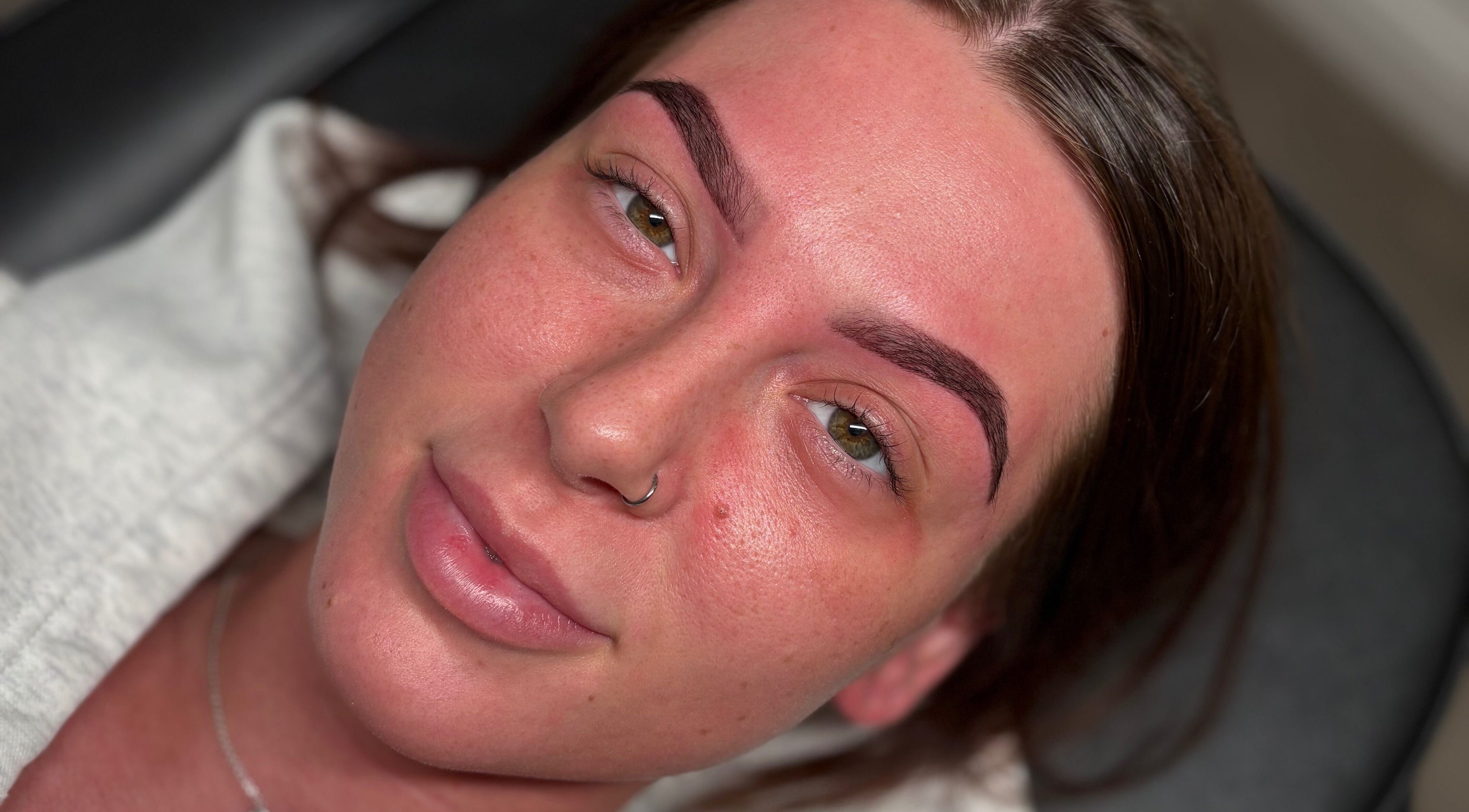 Close-up of a woman's face showing perfect eyebrows at ByEllebeauty, Darwen, England, GB.