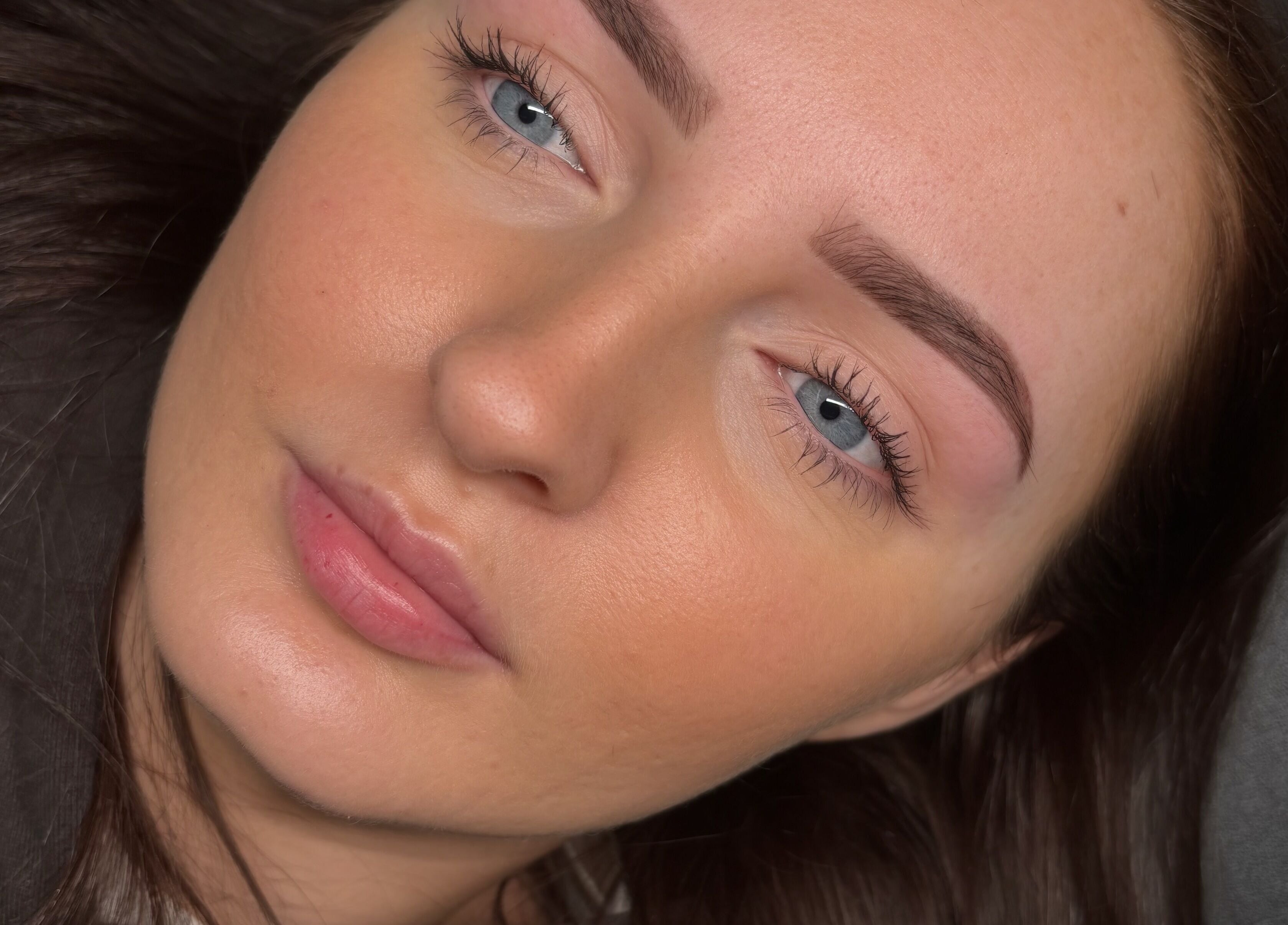 Close-up of a client's flawless skin post-treatment at ByEllebeauty, Darwen, England, GB.