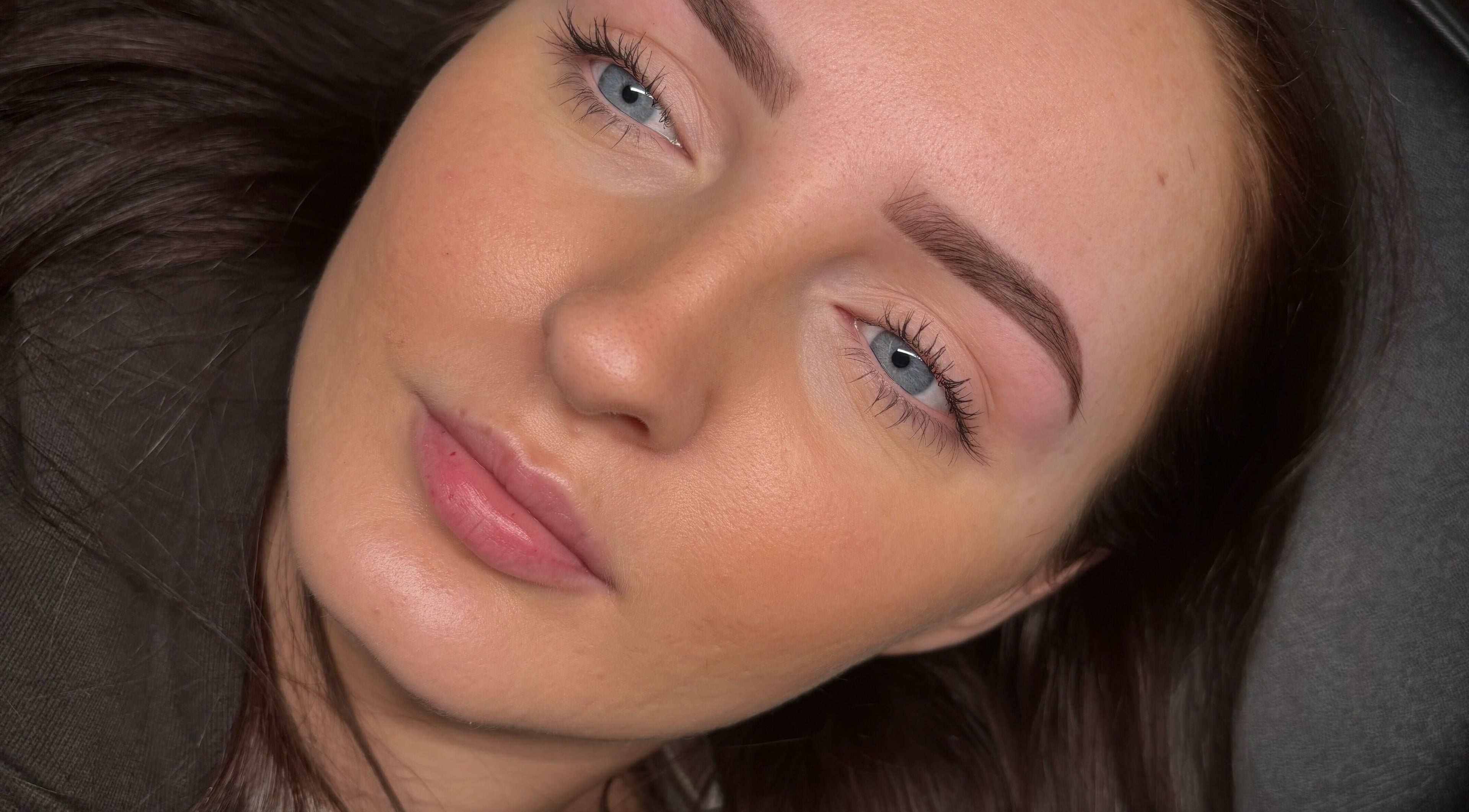 Close-up of a client's flawless skin post-treatment at ByEllebeauty, Darwen, England, GB.