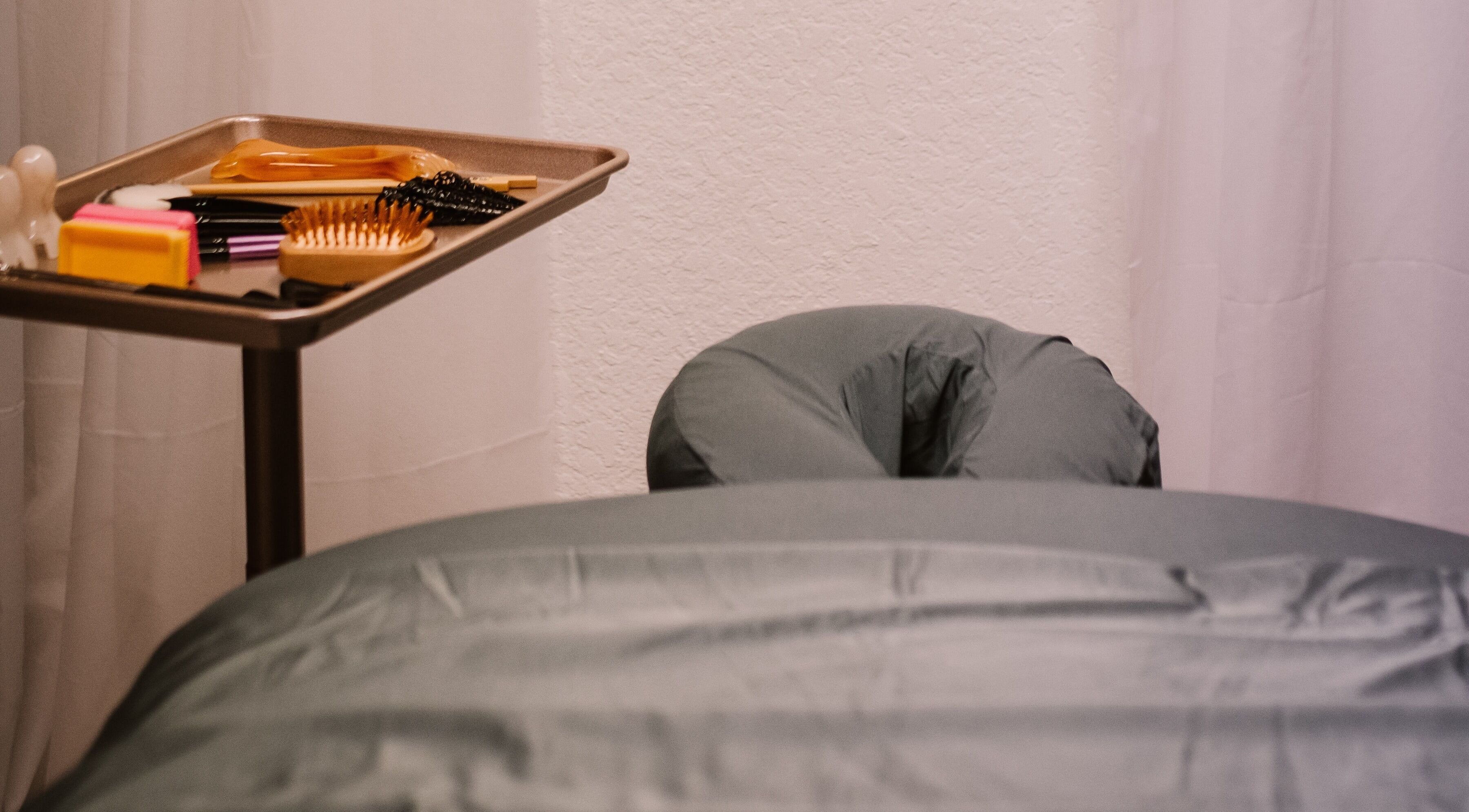 Massage setup at Scratched in Modesto, California, US with tools and a treatment bed.