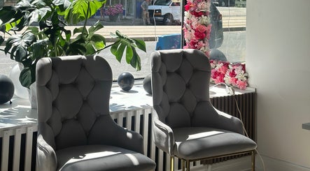 Cozy chairs and floral decor at Elavine Nail Studio, Toronto, Ontario, CA.