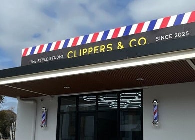 HairbyEsther-Clippers & Co facade in Paradise, South Australia, showcasing its vibrant barber sign.