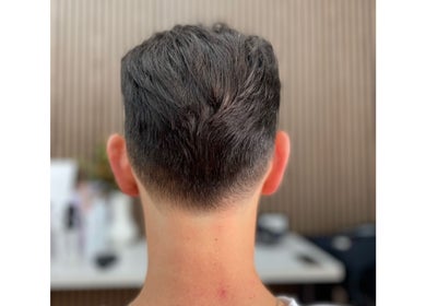 Close-up of a modern men's fade haircut at HairbyEsther-Clippers & Co, Paradise, South Australia, AU.