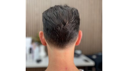 Close-up of a modern men's fade haircut at HairbyEsther-Clippers & Co, Paradise, South Australia, AU.