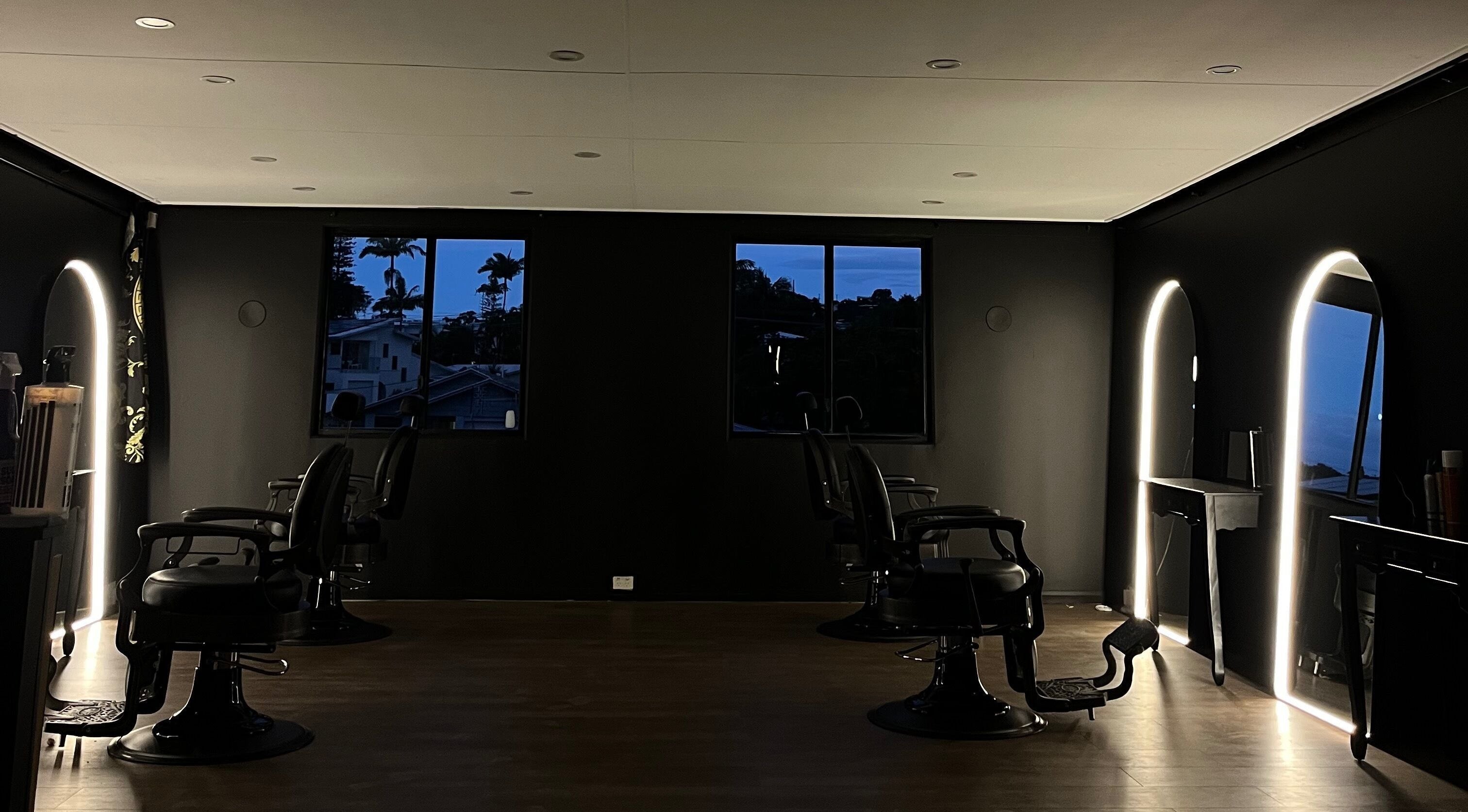 Chic nighttime interior of OCD CUTZZ - The Brothers Boards & Barbers in Maroochydore, Queensland, AU.