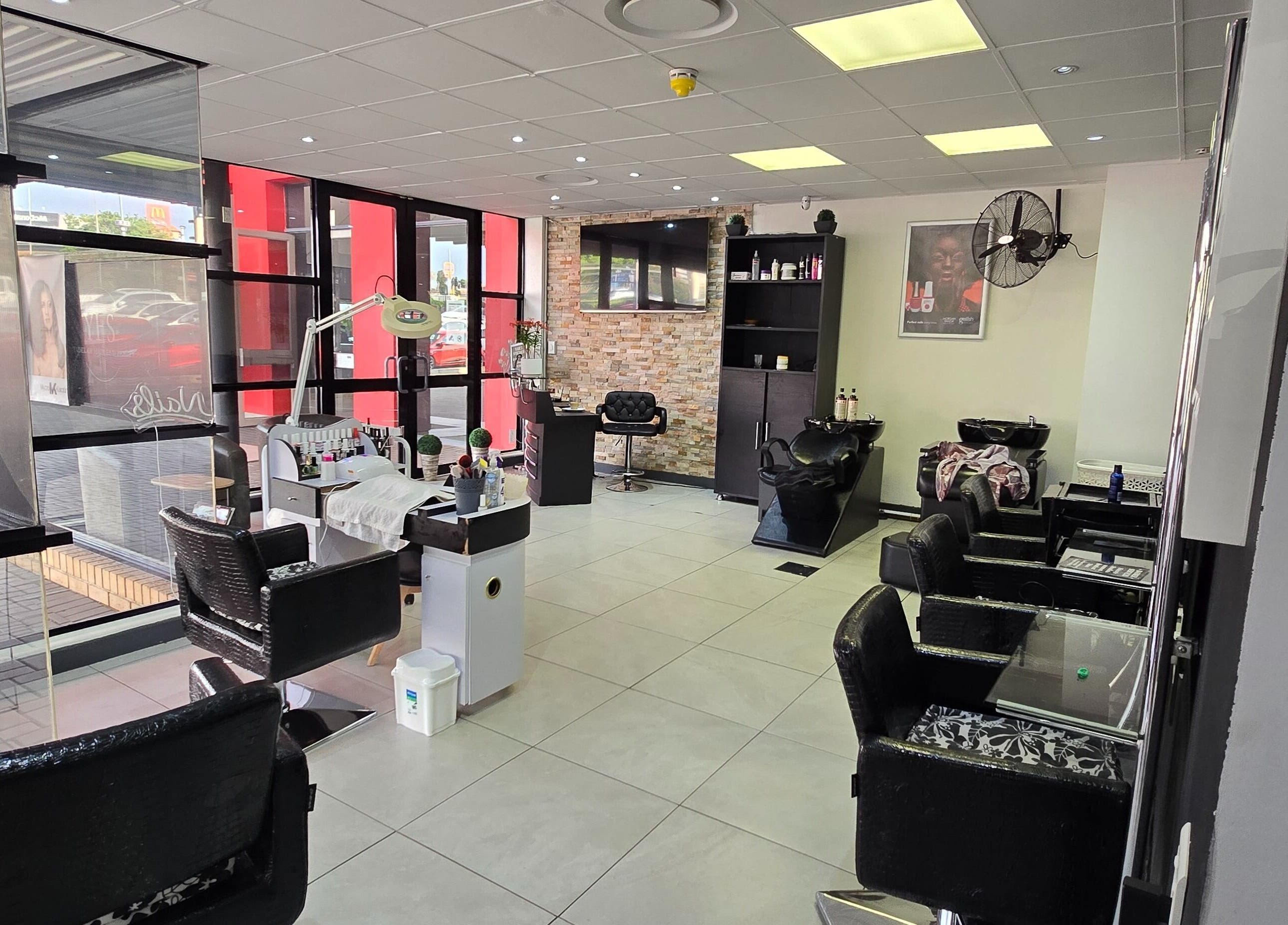 Modern interior of Legacy Heir Studio in Randburg, Gauteng, ZA with stylish salon chairs and beauty equipment.