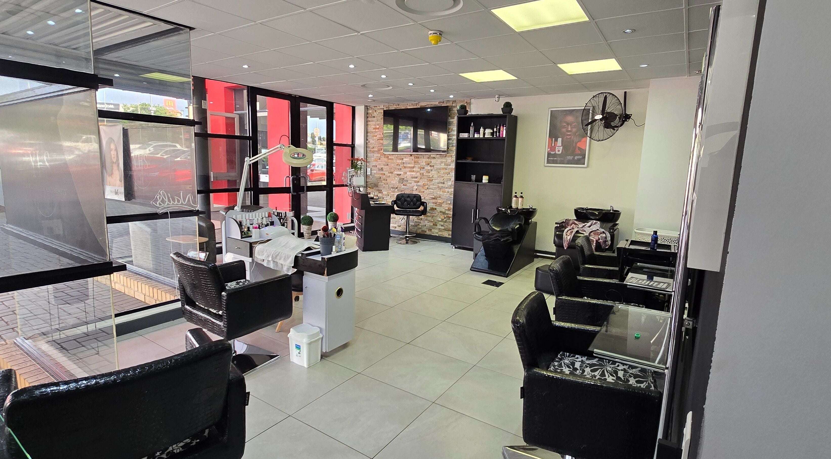 Modern interior of Legacy Heir Studio in Randburg, Gauteng, ZA with stylish salon chairs and beauty equipment.