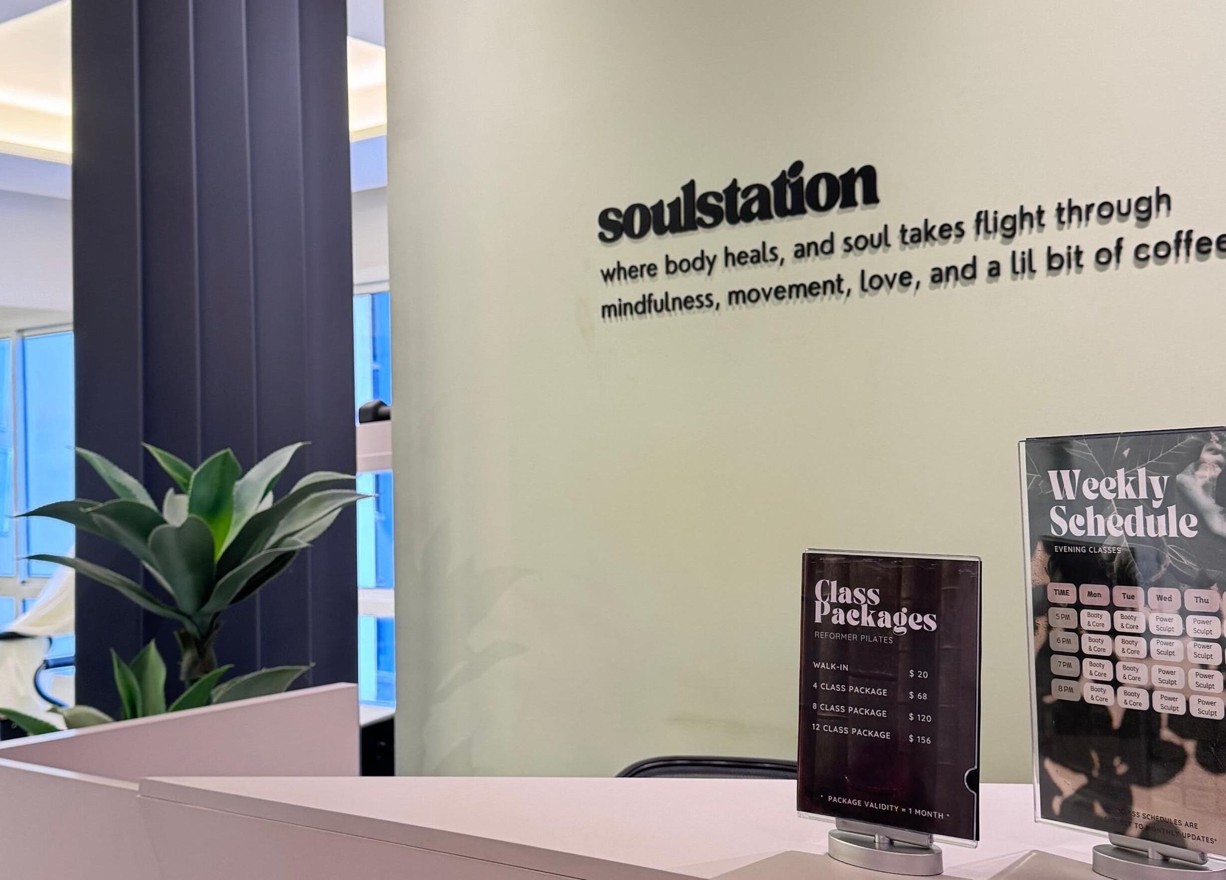 Reception area of SoulStation Pilates, Zalqa, Mount Lebanon Governorate, LB with class schedules displayed.