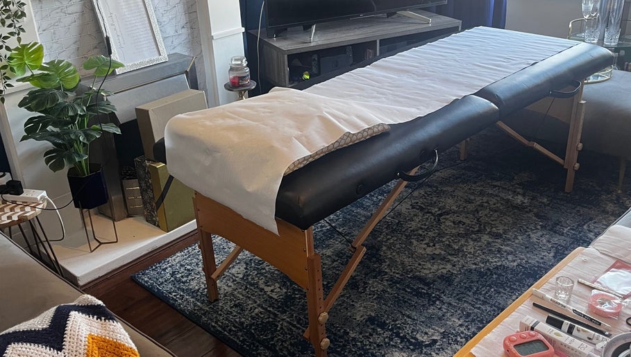 Massage table at Flutterbrows, Rumney, Wales, GB. Cozy, tranquil setting for beauty and wellness treatments.