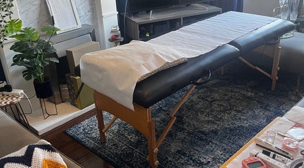Massage table at Flutterbrows, Rumney, Wales, GB. Cozy, tranquil setting for beauty and wellness treatments.