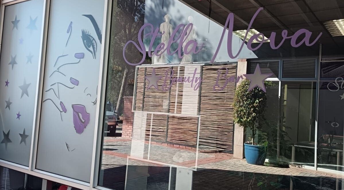 Front view of Stella Nova Beauty Bar in Bloemfontein, Free State, ZA with artistic window graphics.