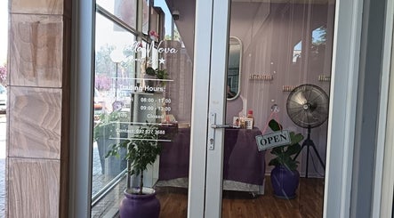 Entrance of Stella Nova Beauty Bar in Bloemfontein, Free State, ZA with open sign and elegant decor.