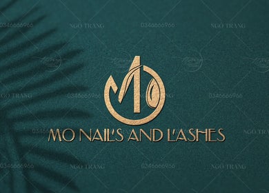 Elegant logo for MO nails and lashes in Auckland, NZ with a shadow effect on a dark green background.