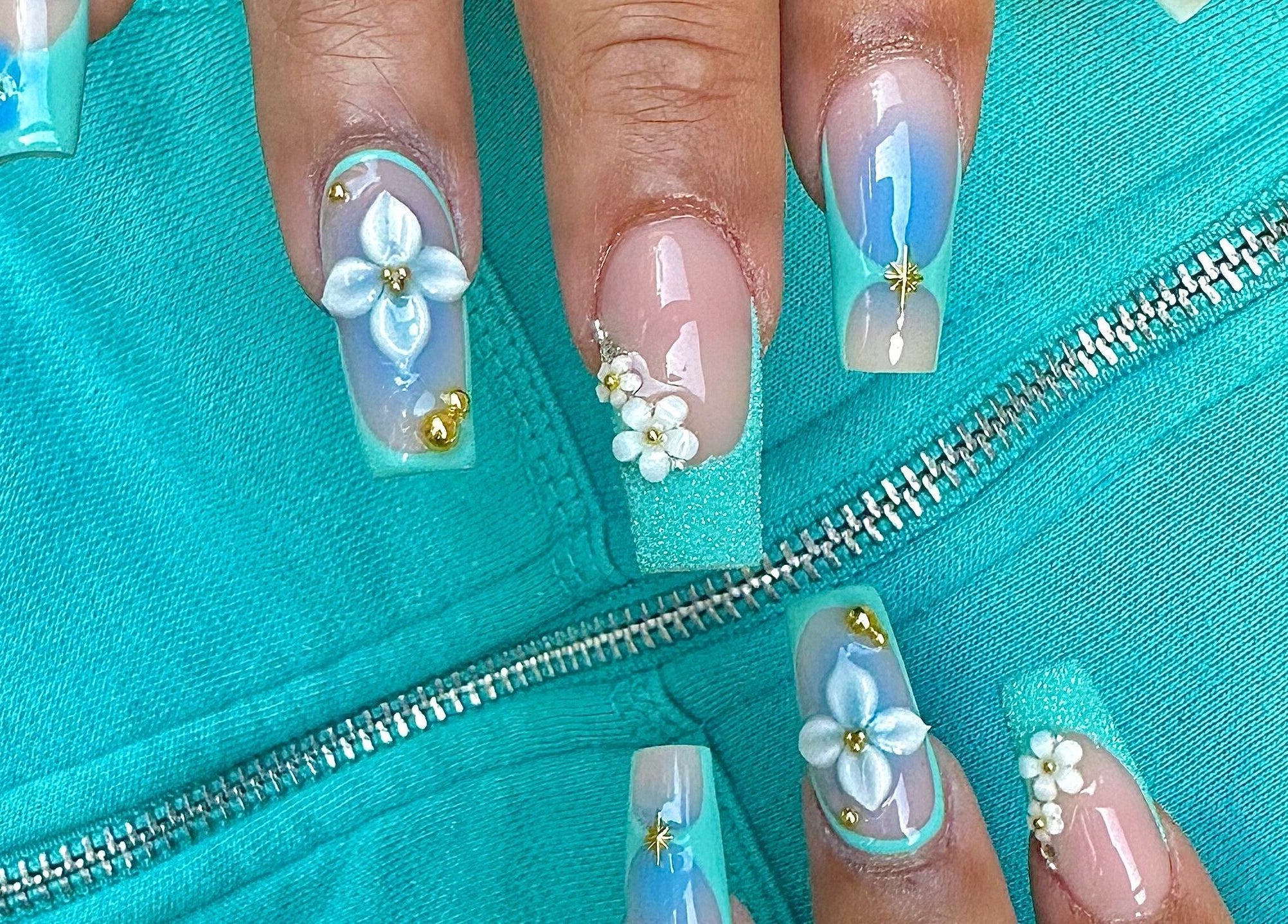 Stylish aqua floral nails at MO nails and lashes, Auckland, Auckland, NZ.