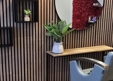 Elegant salon interior at Little Red, London, England, GB with modern decor and a stylish chair.