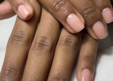 Elegant manicure at Kym Christian, Woodvale, Western Australia, AU. Showcasing flawless natural nail polish.