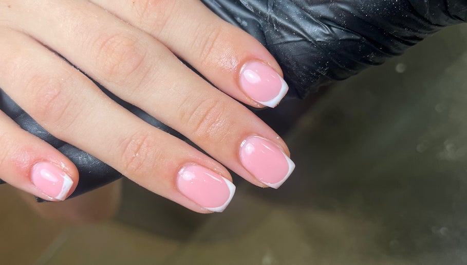 Elegant French manicure at C.B.Nails, Bacup, England, GB. Perfectly polished pink nails with white tips.