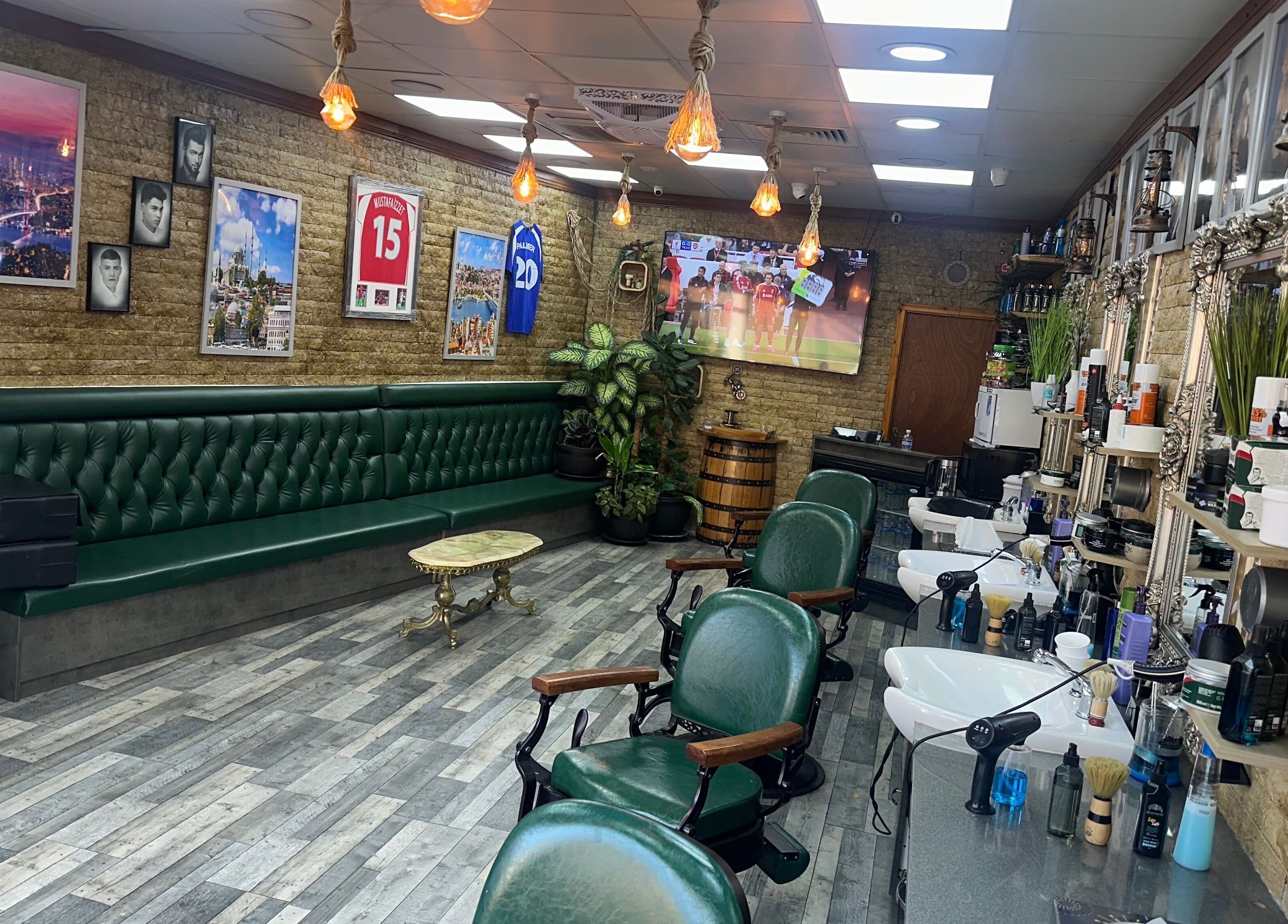 Interior of Istanbul Barber Rosehill in Sutton, England, GB, featuring vintage decor and classic barber chairs.