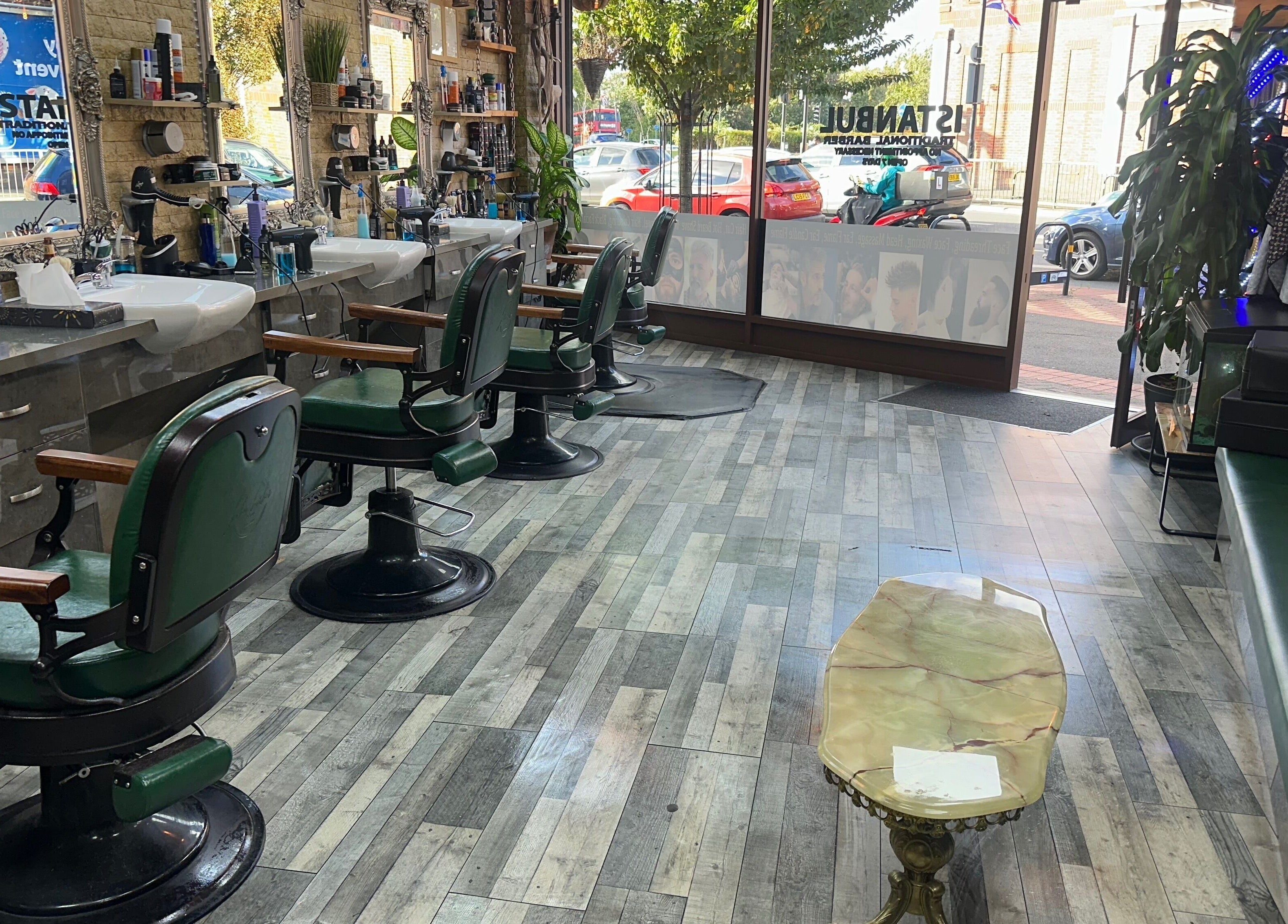 Interior of Istanbul Barber Rosehill in Sutton, England, GB, featuring traditional barber chairs and modern decor.