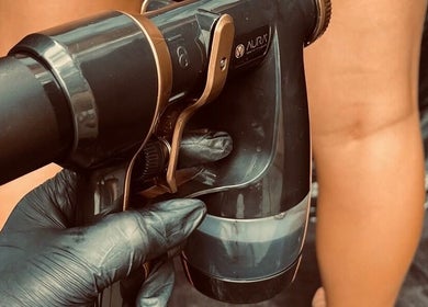 Tanning spray in use at Tanning By Hazel, West Parley, England, GB, creating a flawless golden tan.