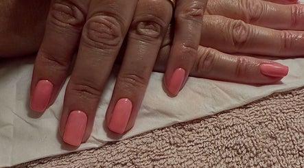 Elegant peach manicure at The Lush Lounge, Midhurst, England, GB showcasing impeccable nail care.