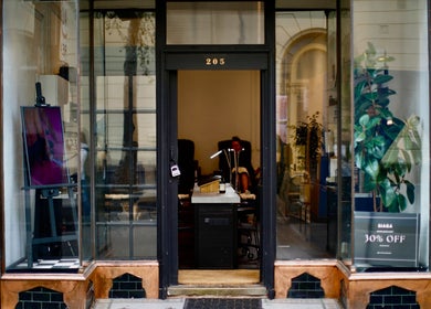 Stylish entrance of Siaga Melbourne in Prahran, Victoria, AU with modern decor and sale sign.