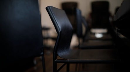 Modern black chairs at Siaga Melbourne, Prahran, Victoria, AU, highlighting elegant and serene ambiance.