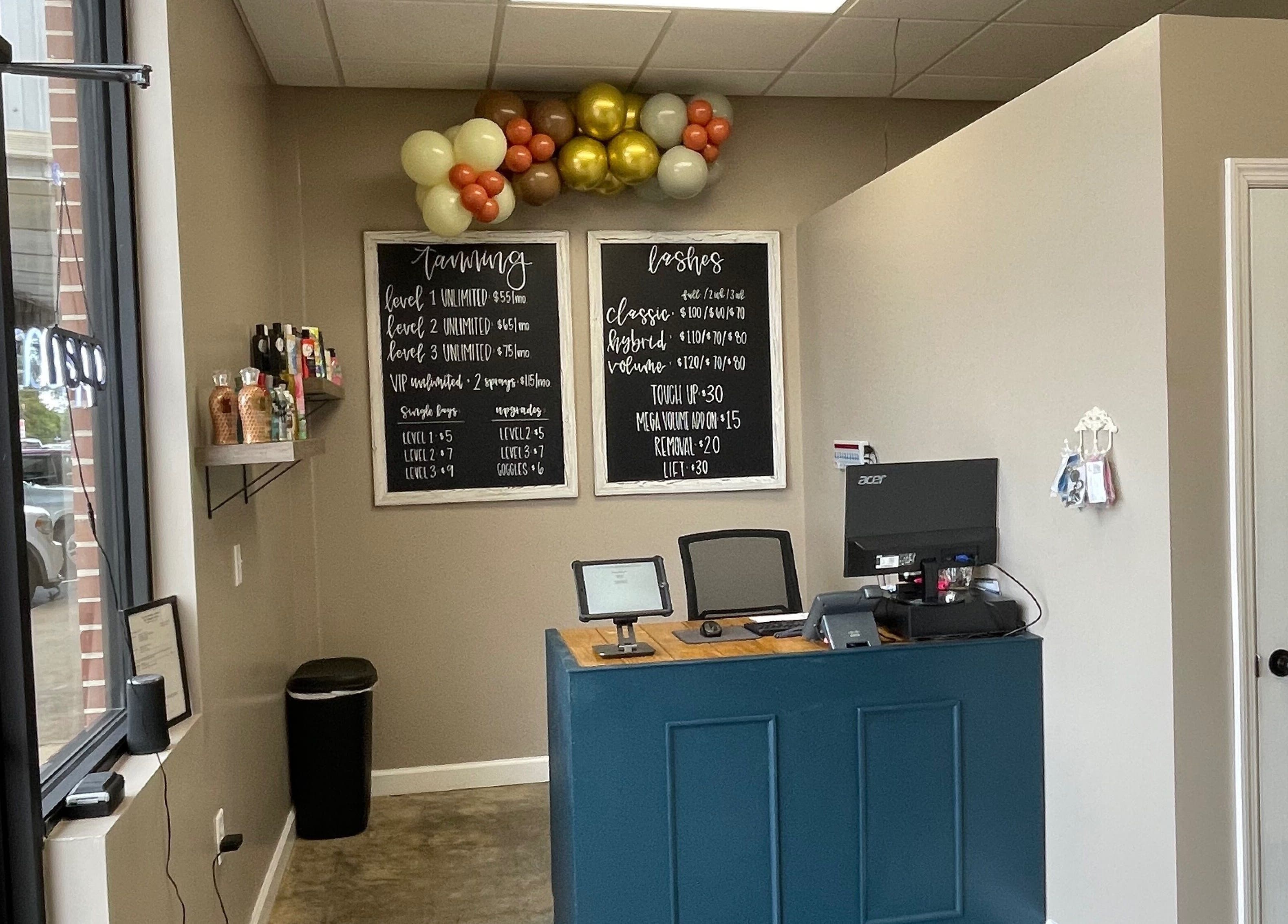 Reception area at Ready Set Glow Tanning LLC, La Fayette, Alabama, US, with price lists and decor.