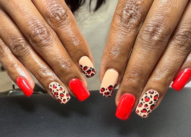 Leopard print and red nails at Honey Blush Beauty, Middelburg, Mpumalanga, ZA. Perfect for a stylish look.