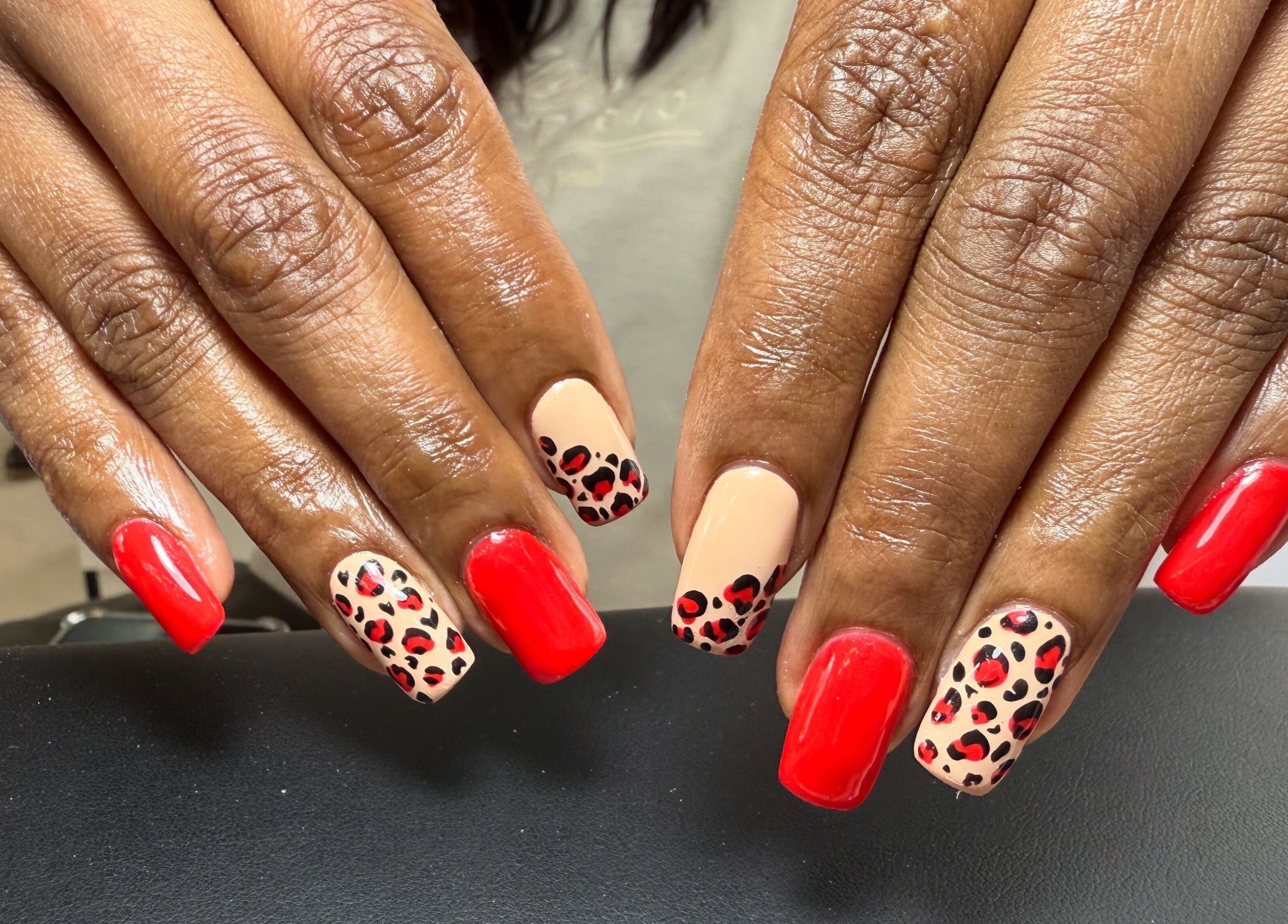Stylish red and leopard print nails at Honey Blush Beauty, Middelburg, Mpumalanga, ZA.