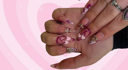 Elegant pink and purple nail art at Kittyscybernails, Federal Heights, Colorado, US.