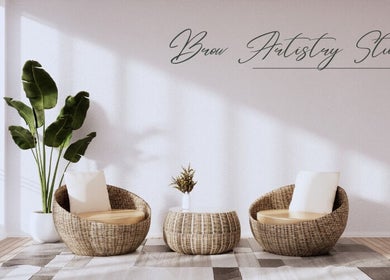 Elegant seating area at Brow Artistry Studio, Anaheim, California, US, with natural light and stylish decor.