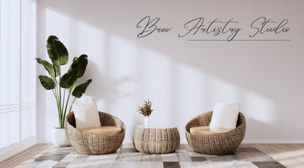 Elegant seating area at Brow Artistry Studio, Anaheim, California, US, with natural light and stylish decor.