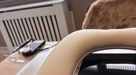 Luxurious treatment chair at Sculpted Studio, Cwmtillery, Wales, GB, offers comfort and elegance.