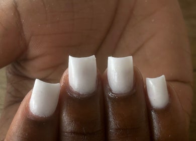 Close-up of a fresh white manicure at Flyynailss, Saint James, Saint James, BB.
