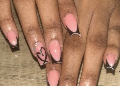 Stylish nail design at Flyynailss, Saint James, BB featuring pink polish with heart detail.