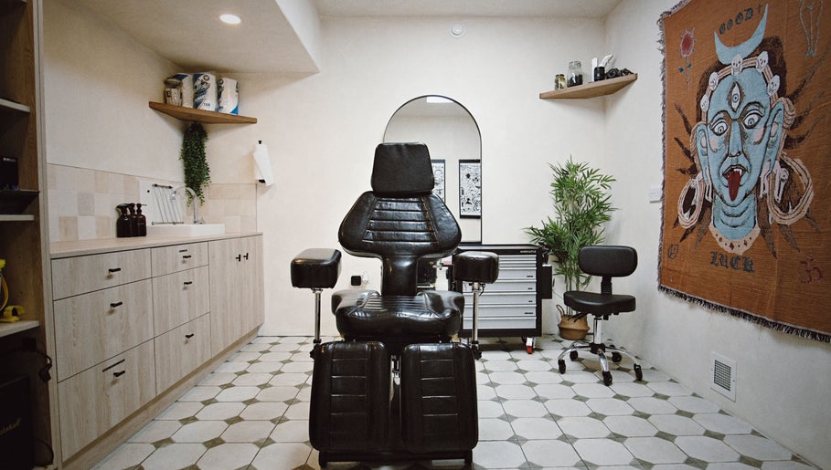 Tattoo chair in Altar Sheffield, a beauty venue in Sheffield, England, GB, with eclectic decor and serene ambiance.
