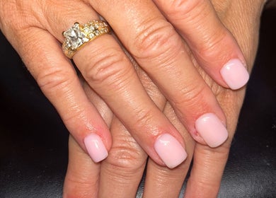 Elegant pink nails with a diamond ring at Rose Dipped Nails, Southampton, England, GB.