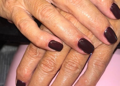 Close-up of dark polished nails at Rose Dipped Nails, Southampton, England, GB showcasing elegant manicure.