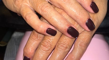 Close-up of dark polished nails at Rose Dipped Nails, Southampton, England, GB showcasing elegant manicure.