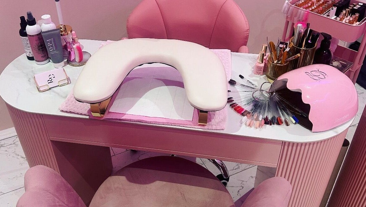 Elegant nail station at Rose Dipped Nails, Southampton, England, GB, showcasing manicure tools and color palettes.