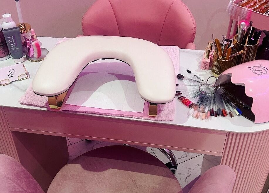 Elegant nail station at Rose Dipped Nails, Southampton, England, GB, showcasing manicure tools and color palettes.