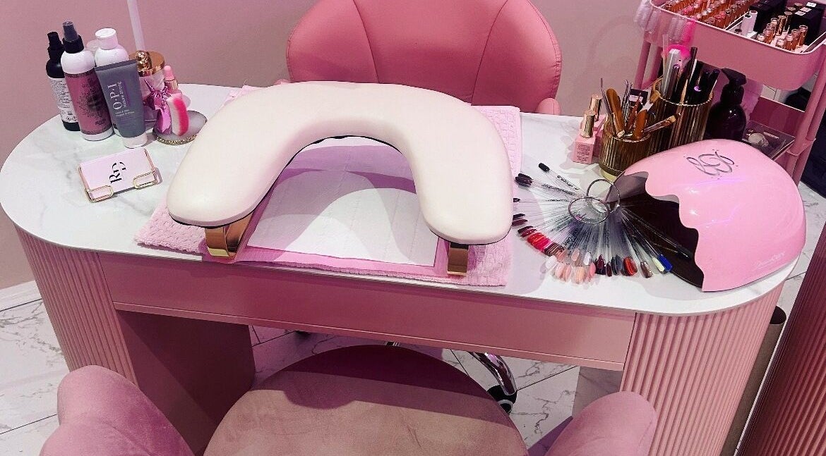 Elegant nail station at Rose Dipped Nails, Southampton, England, GB, showcasing manicure tools and color palettes.