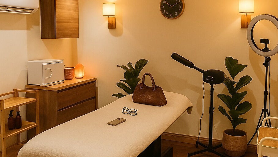 Relaxing beauty treatment room at Solvedda, London, England, GB, styled with warm lighting and serene decor.