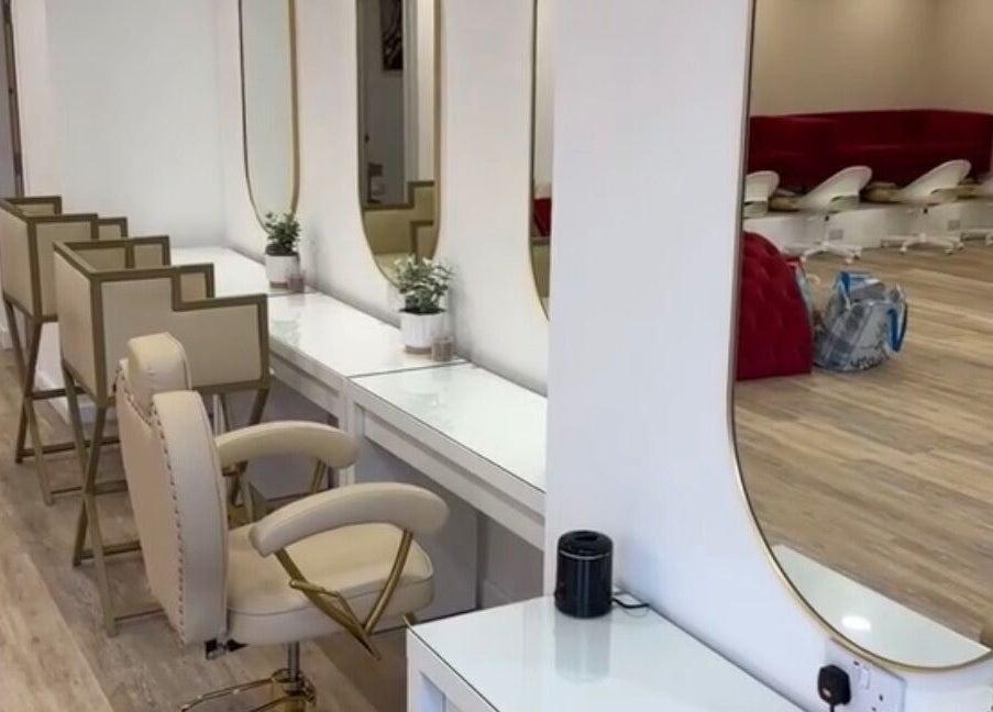 Chic, modern interior of Hair By Diaz Kidd, Inverurie, Scotland, GB with stylish seating and mirrors.